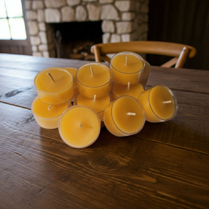 Handcrafted Ontario beeswax tealight candles arranged in a warm table setting, natural honey scent