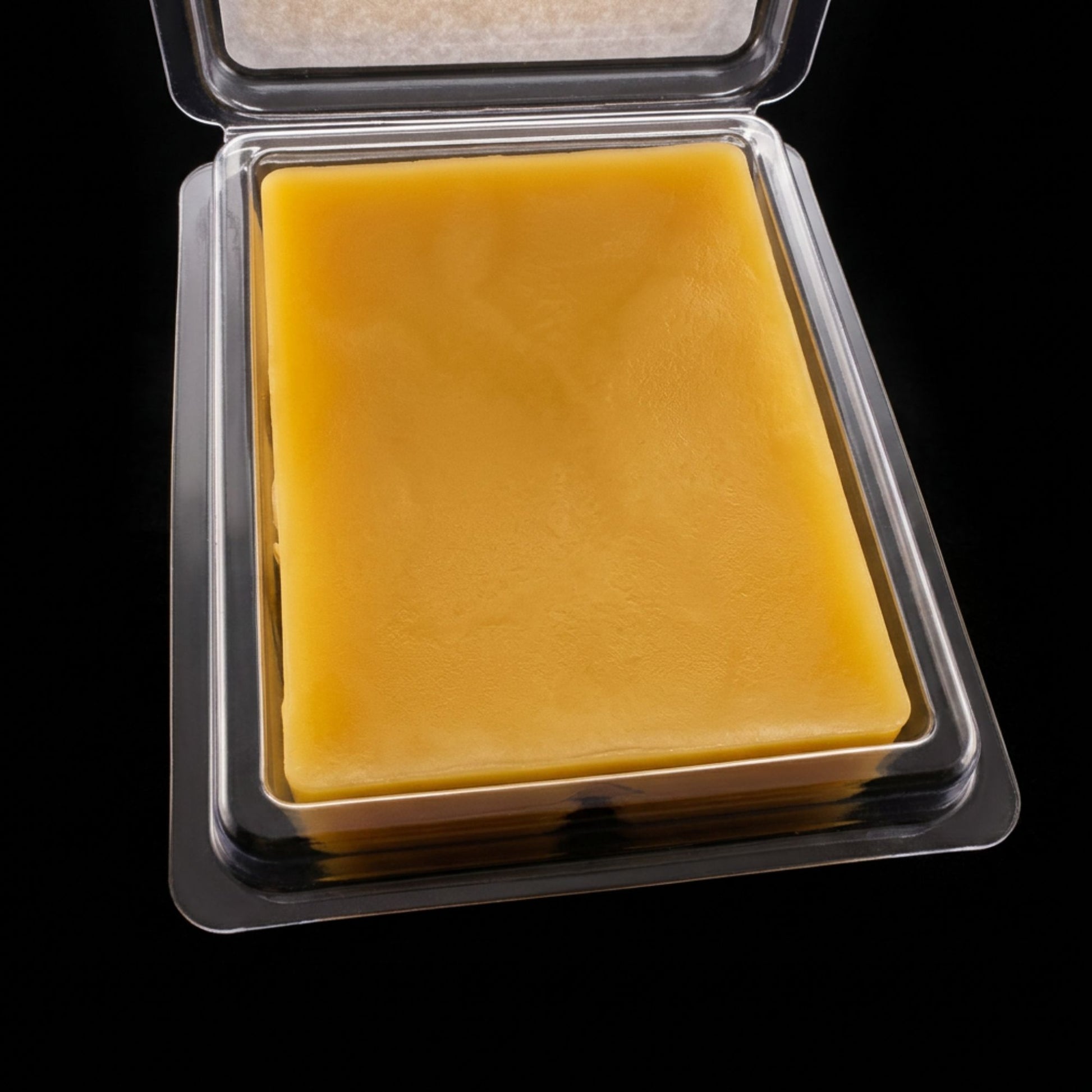 An opened package of blue raspberry beeswax melt from sticky bee apiary.