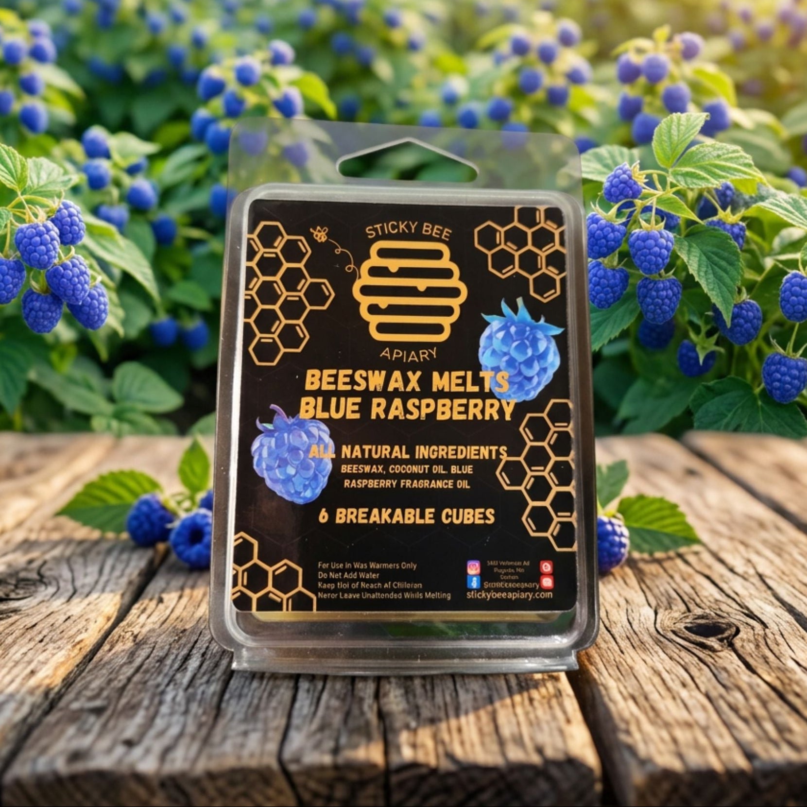 Beeswax melt packaging with blue raspberry flavor on a wooden surface with blueberries in the background