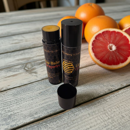 Close-up of Sticky Bee Apiary grapefruit beeswax lip balm texture and packaging