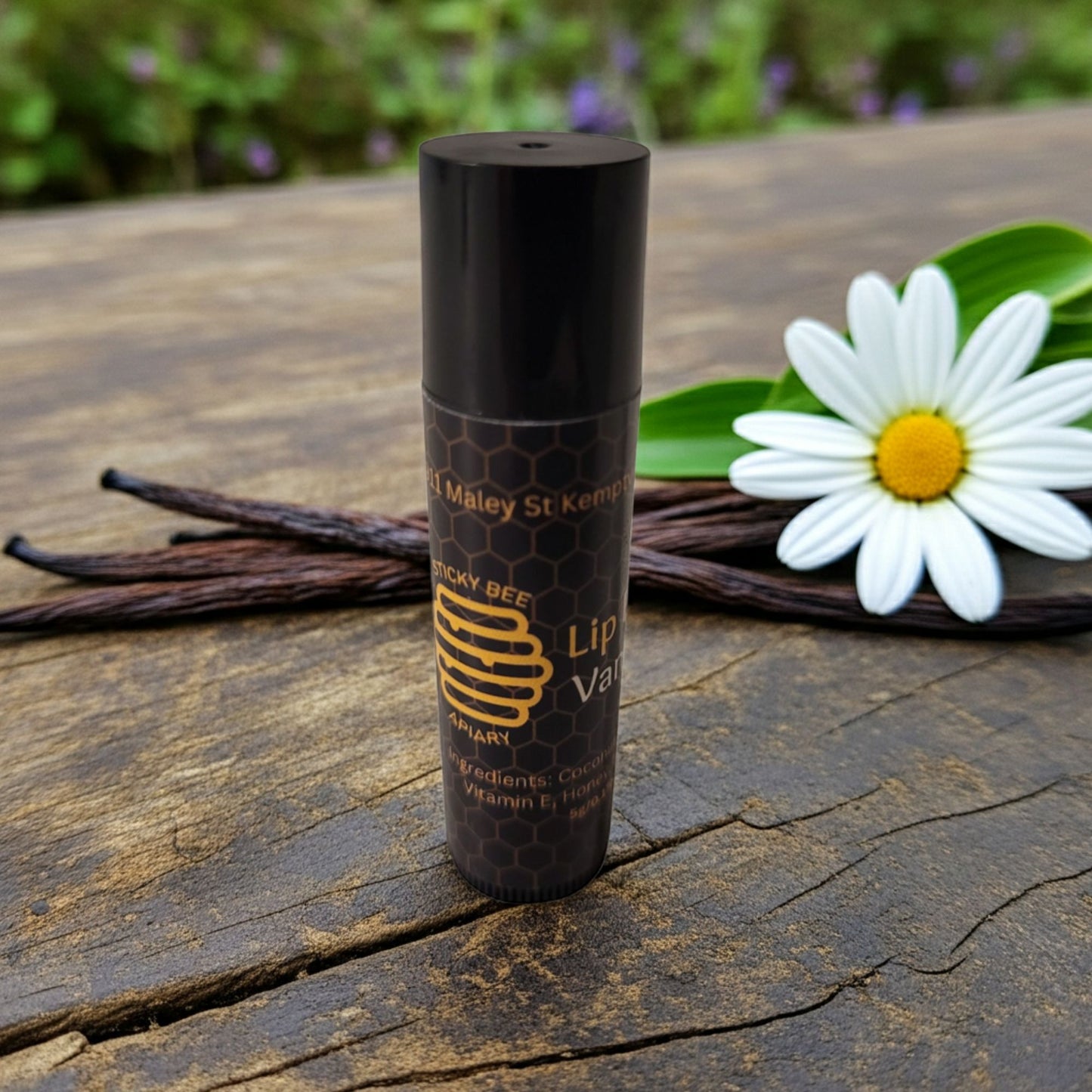 Close-up of Sticky Bee Apiary vanilla beeswax lip balm texture and packaging